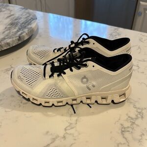 On Running White and Black Athletic Shoes
